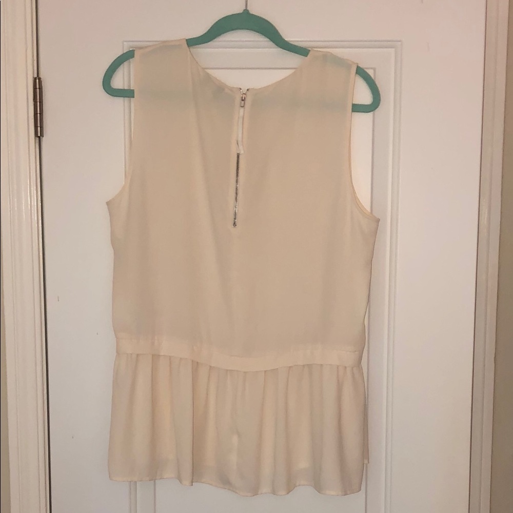 Jcrew off white sleeveless flounce top.